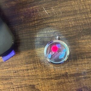 locket with genuine ruby, tourmaline, enhydro quartz, and natural opal